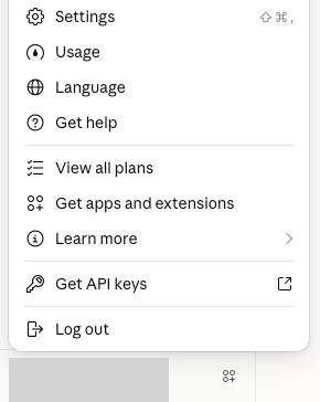 Claude account menu with Settings at the top; account details are hidden.